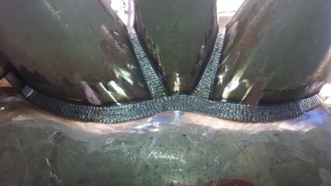 Multi-pass structural weld seam joining heavy plate sections inside a fabricated vessel