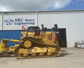 A Caterpillar dozer parked in front of the ABC Heavy Engineering workshop at Paget