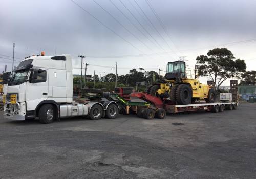 A heavy mine-spec forklift loaded on an ABC low-loader ready for delivery